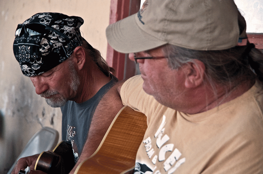 Mark and Jeffro playing music on the porch in Terlingua