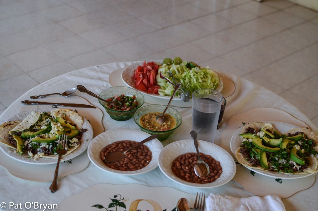 Steak tacos, avocado, beans, chili con queso y chorizo, salad, pico, salsa.