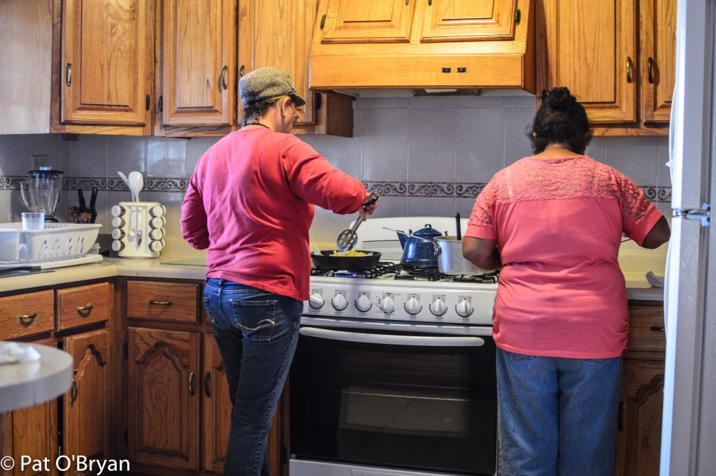 Gloria and Sylvia making magic by hand.